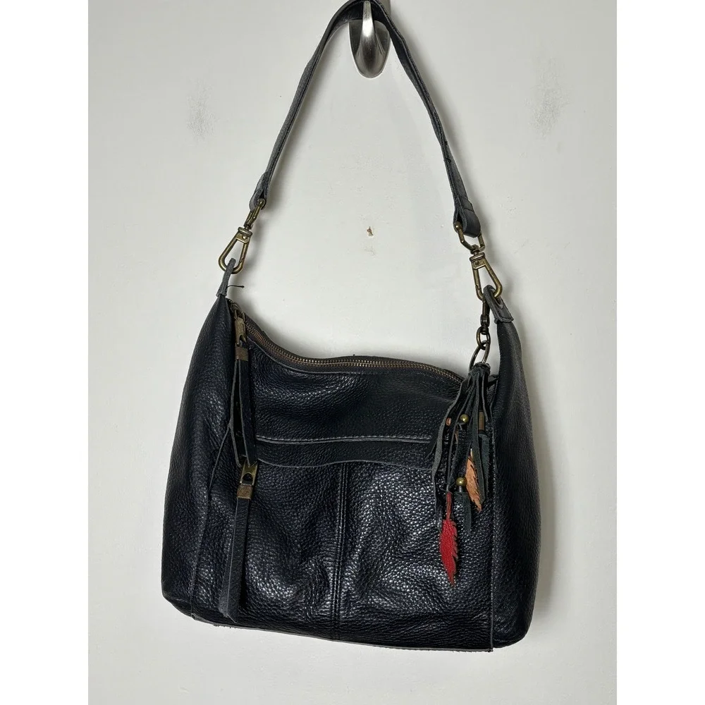 The Sak Alameda Hobo Bag Medium Black Pebbled Leather Feather Fringe Charm